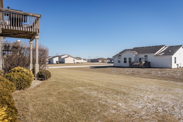 view of yard with a wooden deck