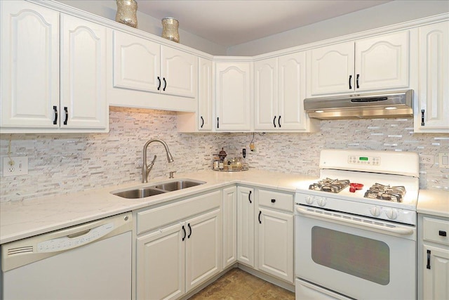 kitchen with white appliances, white cabinetry, and sink