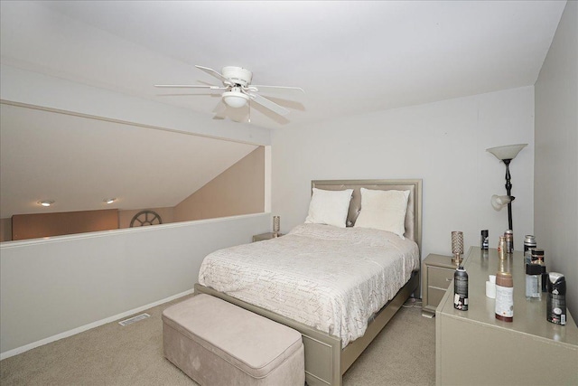 carpeted bedroom featuring lofted ceiling and ceiling fan