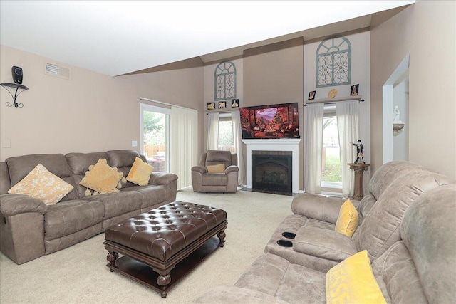 living room featuring a high ceiling and carpet floors