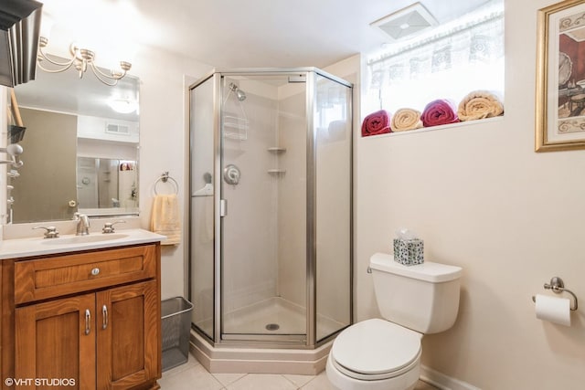 bathroom featuring toilet, an enclosed shower, vanity, and tile patterned floors