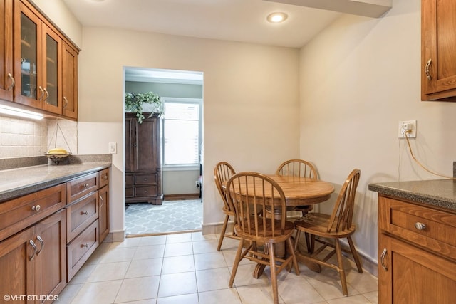 dining area featuring light tile patterned floors