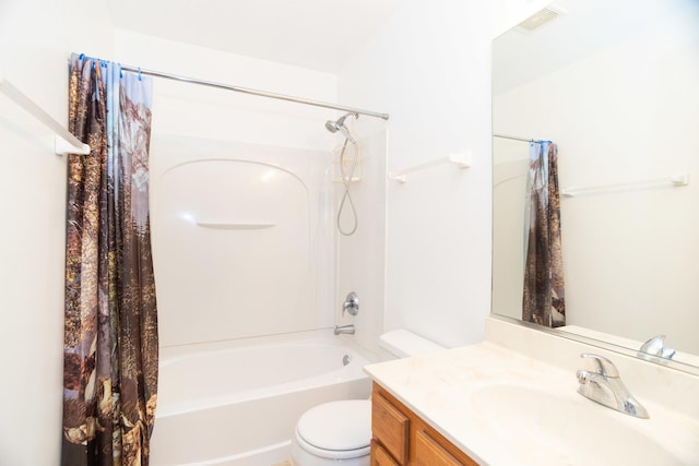 full bathroom featuring shower / tub combo, vanity, and toilet