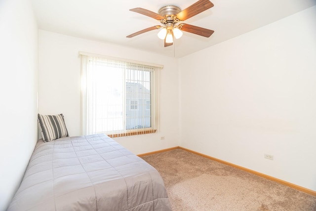 bedroom with ceiling fan and carpet