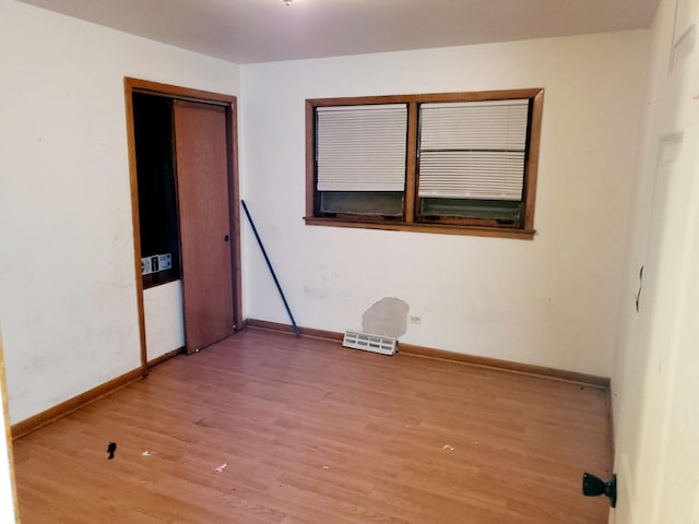 spare room featuring hardwood / wood-style floors