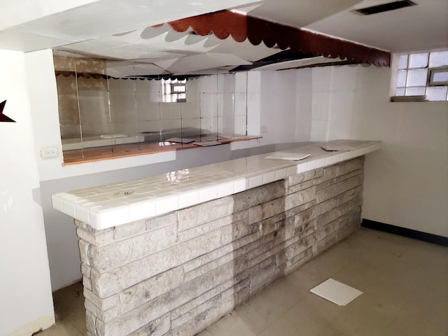 bar featuring tile countertops