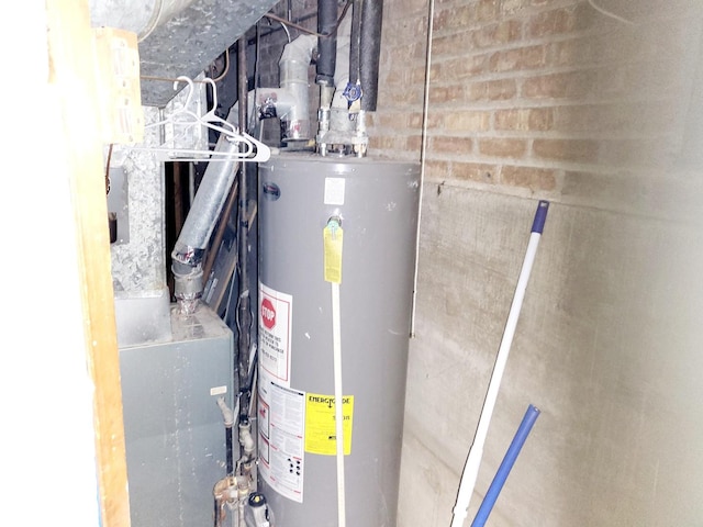 utility room with water heater