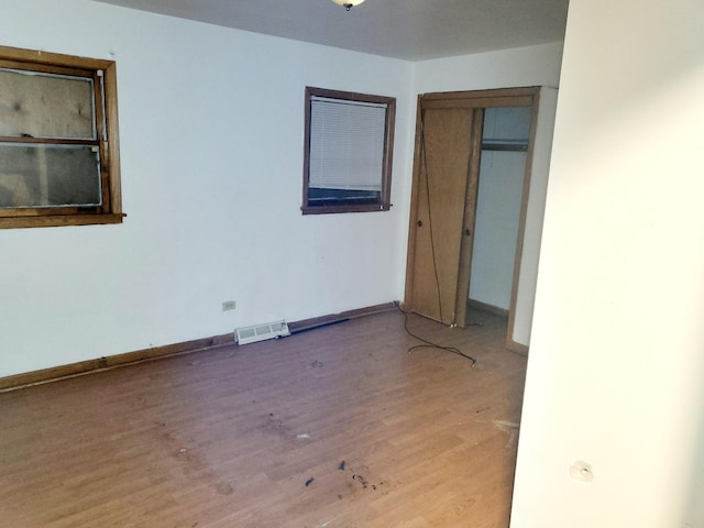 unfurnished bedroom featuring wood-type flooring