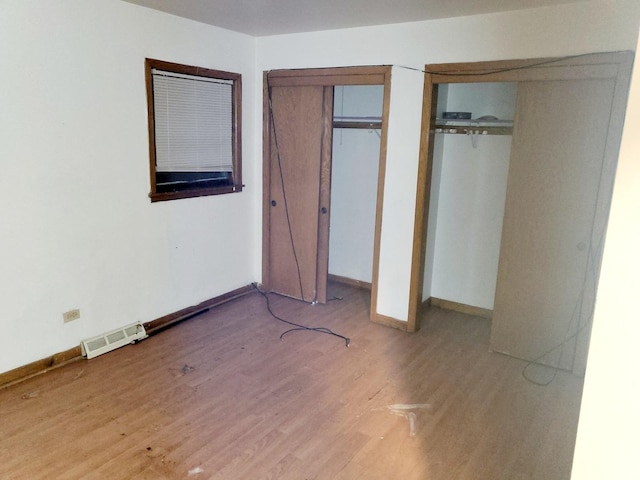 unfurnished bedroom featuring light wood-type flooring