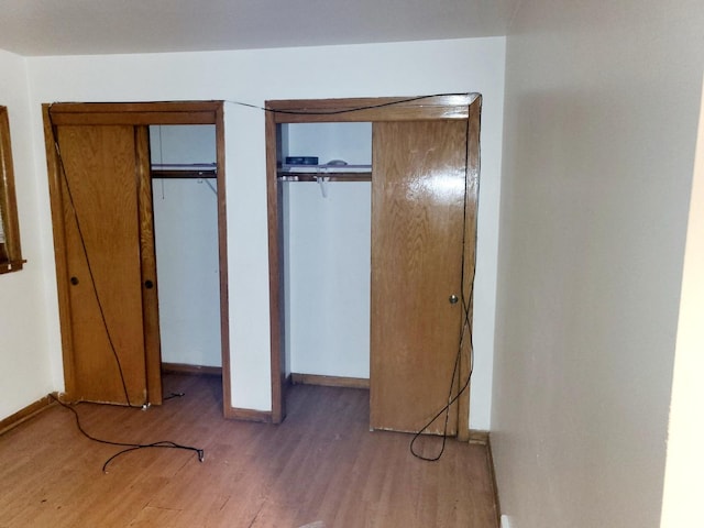 unfurnished bedroom featuring hardwood / wood-style floors