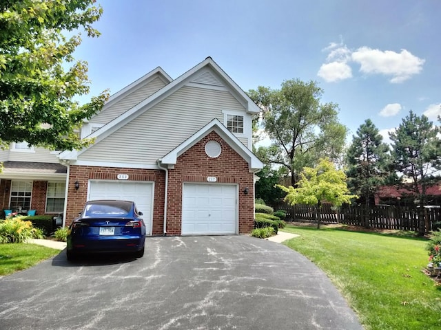 view of side of property featuring a yard and a garage