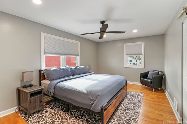 bedroom featuring light wood-type flooring and ceiling fan