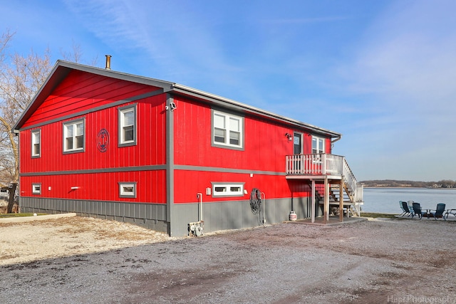 view of side of home featuring a water view