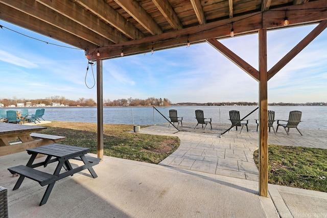 view of patio / terrace with a water view