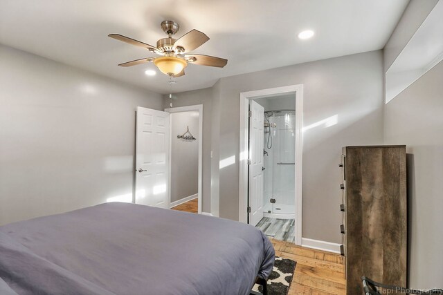 bedroom with ensuite bathroom, ceiling fan, and light hardwood / wood-style flooring