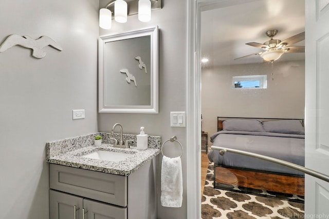 bathroom featuring ceiling fan and vanity