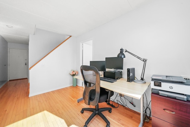 office area with hardwood / wood-style flooring