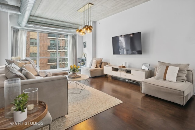 living room with dark hardwood / wood-style flooring