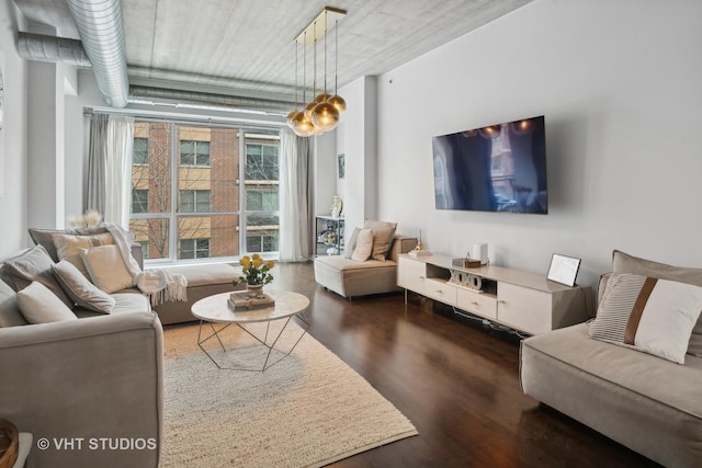 living room with dark hardwood / wood-style flooring