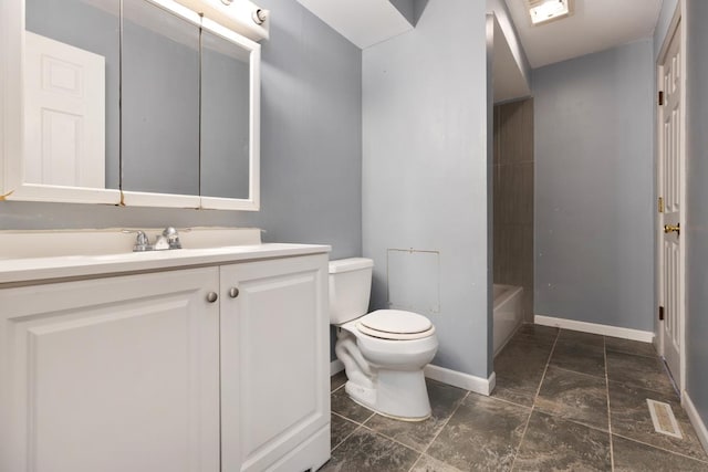 bathroom featuring toilet and vanity