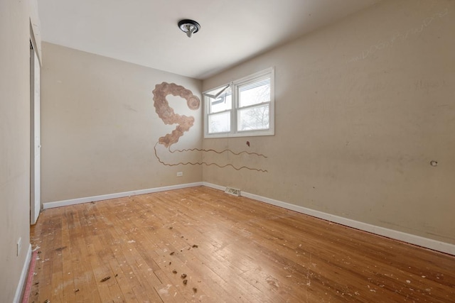 spare room featuring hardwood / wood-style flooring