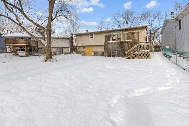 view of snow covered house