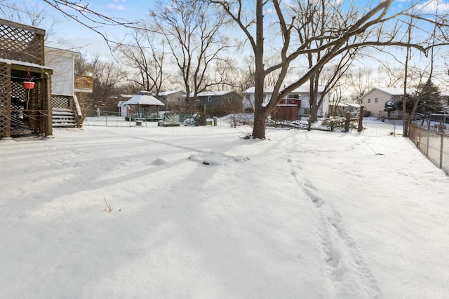 view of yard layered in snow