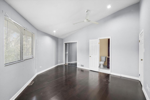 empty room featuring high vaulted ceiling, hardwood / wood-style floors, and ceiling fan