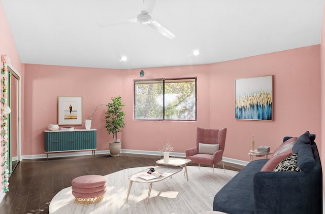 living room featuring wood-type flooring and ceiling fan