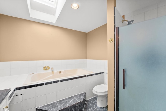 bathroom with toilet, a relaxing tiled tub, tile patterned floors, and a skylight