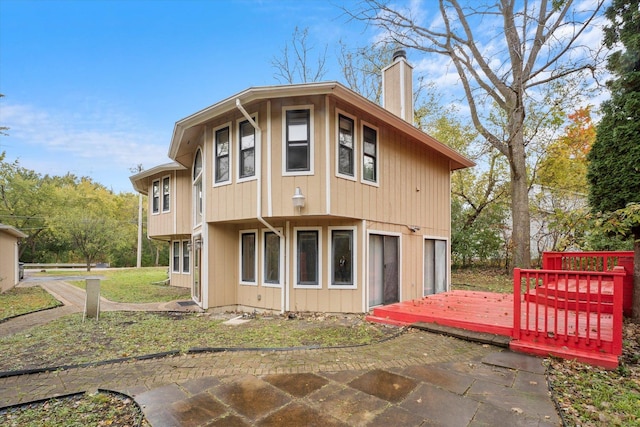 back of house featuring a garage