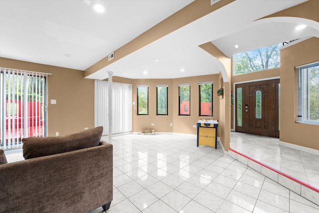 tiled foyer entrance featuring ornate columns