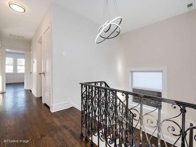 corridor featuring dark hardwood / wood-style floors