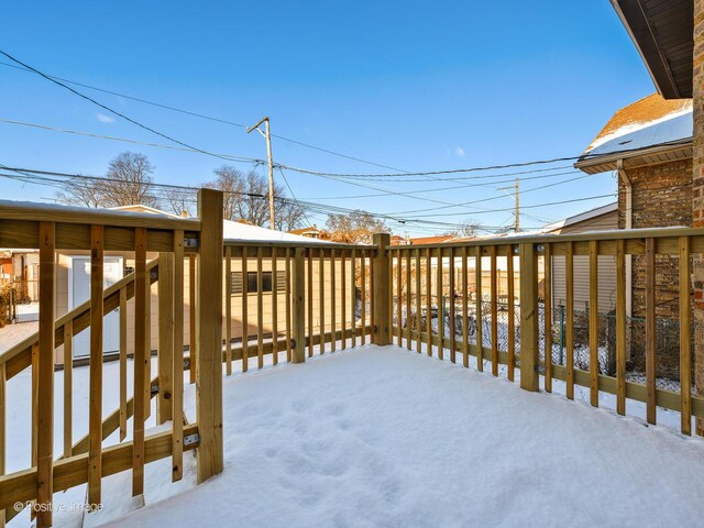 view of snow covered deck