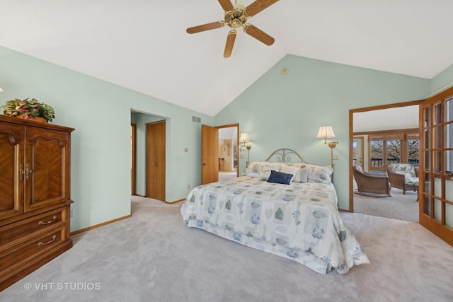 bedroom with ceiling fan, lofted ceiling, and light carpet