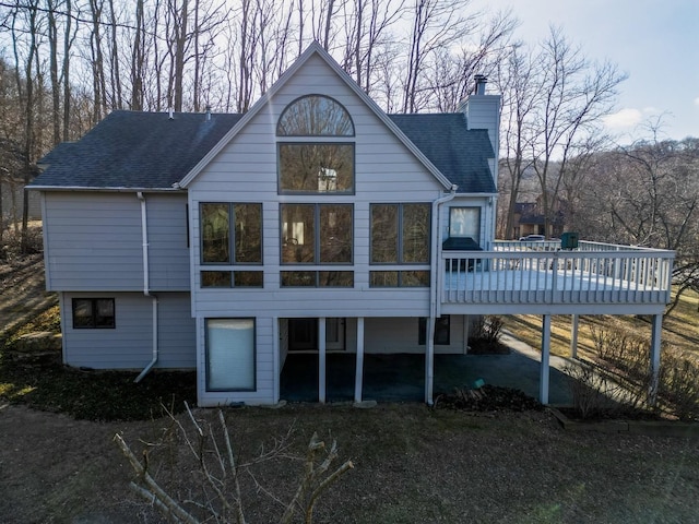 rear view of house with a deck