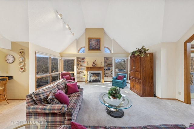 living room featuring vaulted ceiling, light carpet, and track lighting