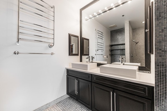 bathroom featuring tile patterned flooring, walk in shower, radiator heating unit, and vanity