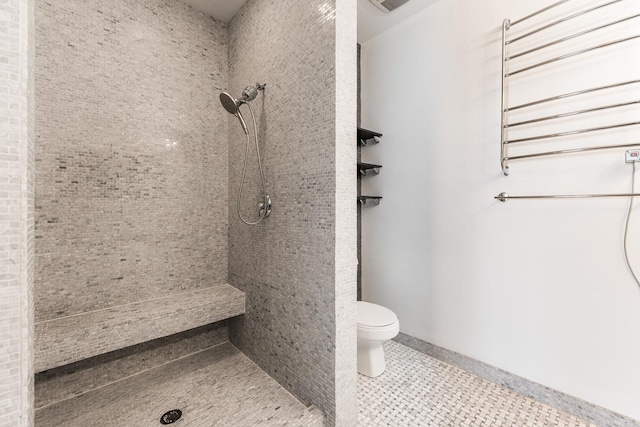 bathroom featuring toilet and tile patterned floors