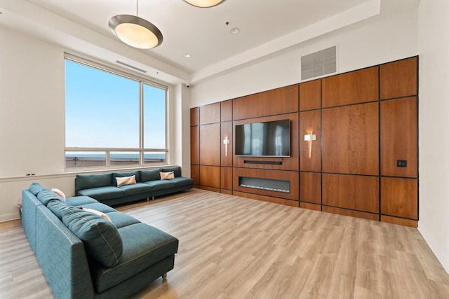 living room with light hardwood / wood-style flooring