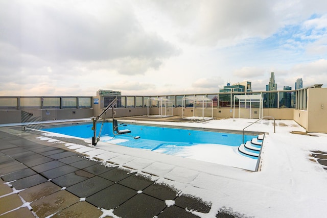 view of swimming pool with a patio area