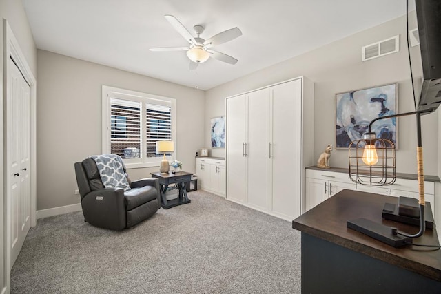 interior space featuring ceiling fan and carpet flooring