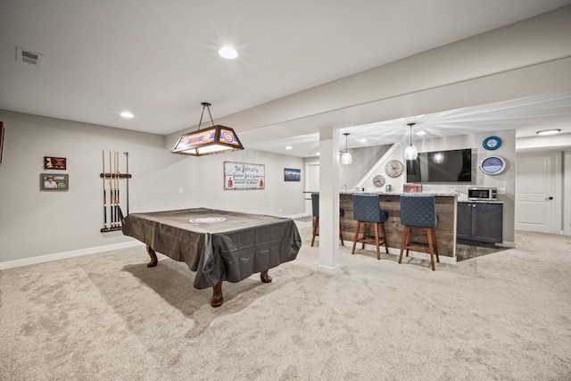 recreation room featuring pool table, light carpet, and bar area