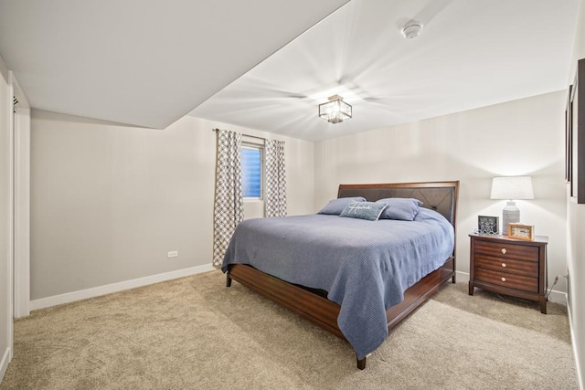 bedroom featuring light carpet