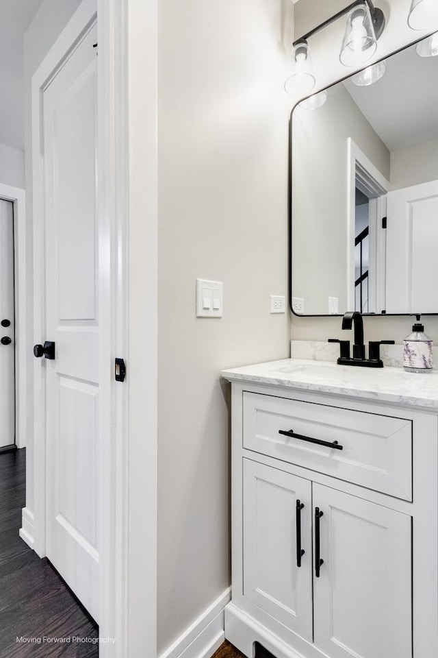 bathroom featuring hardwood / wood-style floors and vanity