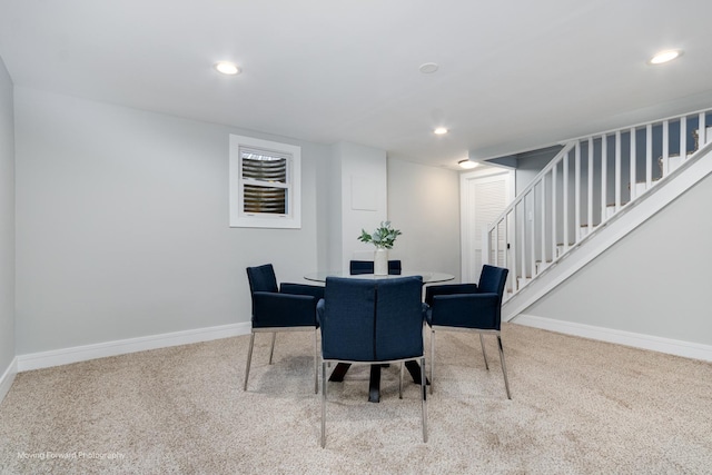 dining space with carpet flooring