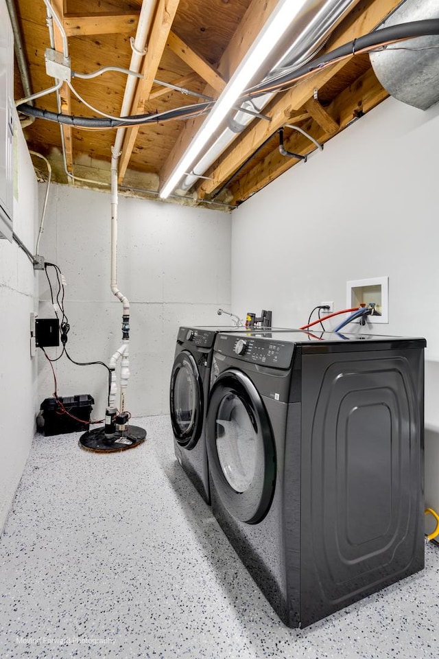 laundry area with washing machine and dryer