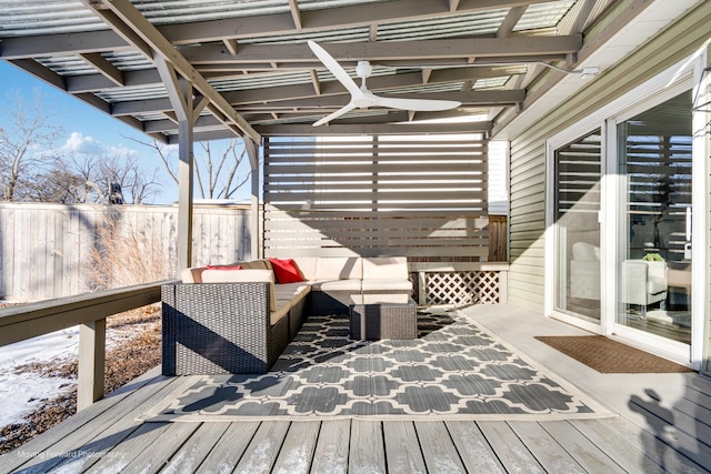 wooden terrace with an outdoor hangout area