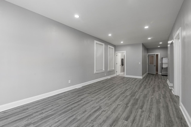 unfurnished living room featuring hardwood / wood-style flooring