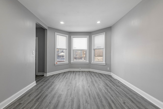 spare room featuring dark hardwood / wood-style flooring